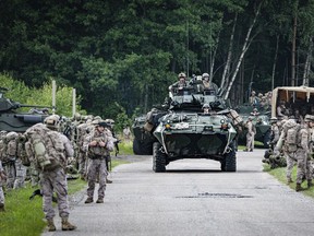 Military armored vehicles take part in the Baltops 2024 exercise in the Baltic Sea region, Sunday June 16, 2024. Some 9,000 troops from 20 NATO countries have been participating this month in military exercises in the Baltic Sea region, which has become strategically sensitive following Russia's invasion of Ukraine.