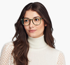 woman wears green Warby Parker Carlton Glasses