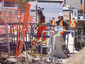 Workers start back on repairs at the water main break repair project in Montgomery on Thursday, June 13, 2024. The repair was on hold while Occupational Health and Safety officers investigated after two workers were injured at the site on Wednesday evening.