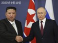 FILE - Russian President Vladimir Putin, right, and North Korea's leader Kim Jong Un shake hands during their meeting at the Vostochny cosmodrome outside the city of Tsiolkovsky, about 200 kilometers (125 miles) from the city of Blagoveshchensk in the far eastern Amur region, Russia, on Sept. 13, 2023. North Korean state media says Russian President Vladimir Putin will arrive in the country on Tuesday for a two-day visit, his first trip to the country in 24 years.