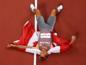 Andre De Grasse of Team Canada celebrates after winning the gold medal