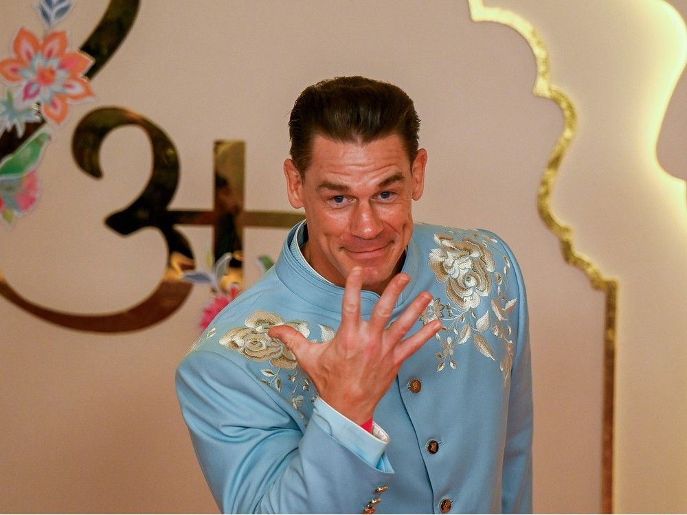 Hollywood actor John Cena poses as he arrives to attend the wedding ceremony of billionaire Mukesh Ambani's son Anant Ambani and fiancee Radhika Merchant in Mumbai on July 12, 2024. 