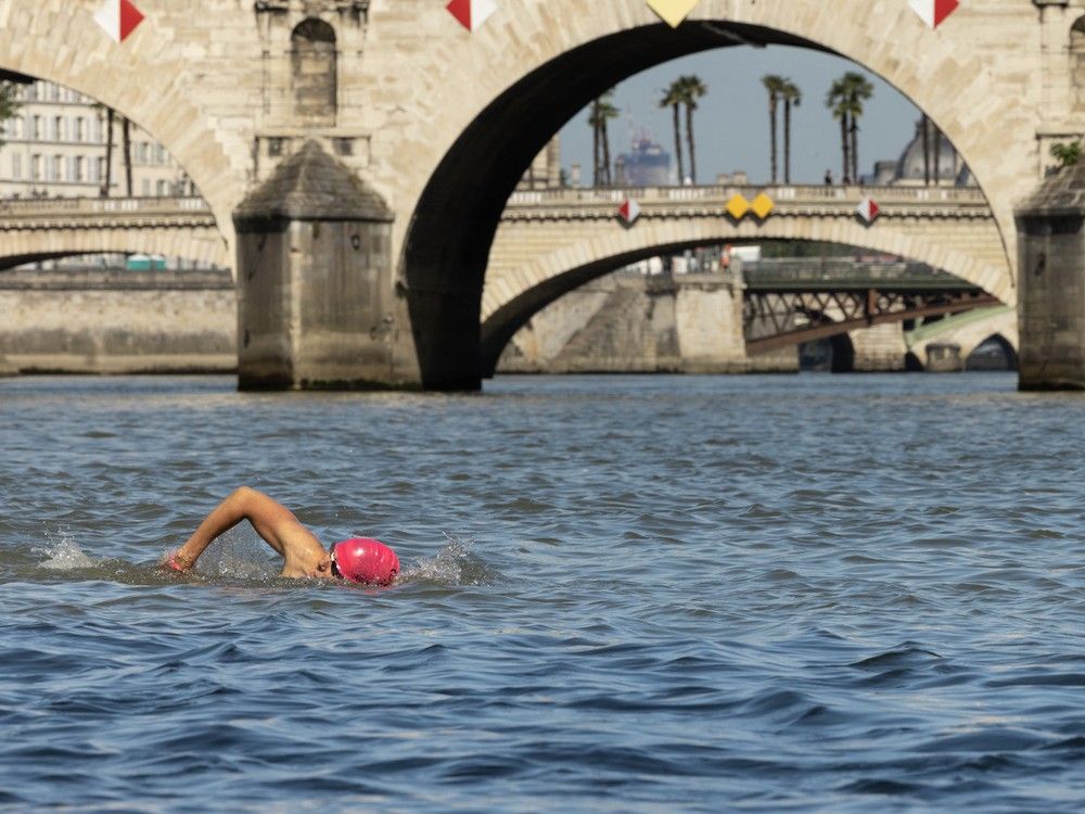 NextImg:Olympic triathletes hope Seine will be clean after cancelled practice: 'I don't swim this much to just run and bike'
