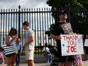 Glenn Boyce and his family show support for President Joe Biden after the president announced his withdrawal from the 2024 race outside the White House on July 21, 2024 in Washington, DC. (Photo by Justin Sullivan/Getty Images)