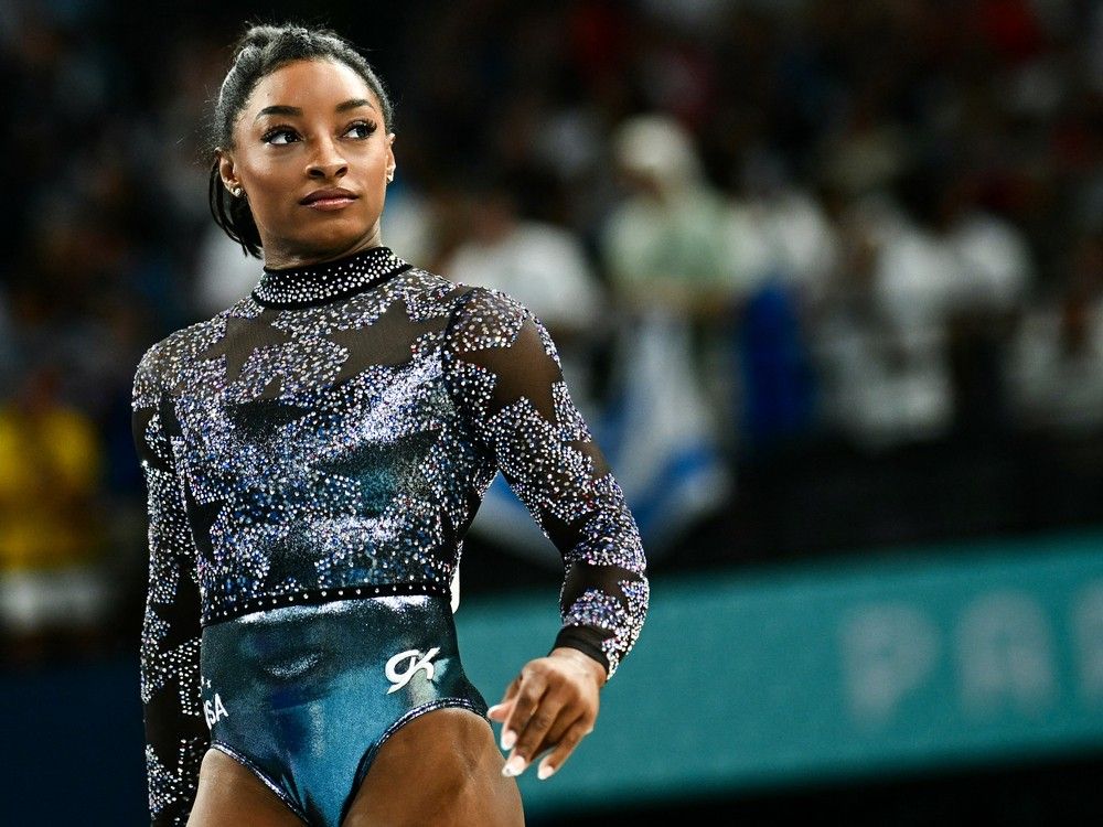 NextImg:Simone Biles says she is dealing with calf discomfort in return to Olympics