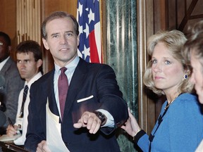 Biden announcing on Sept. 23, 1987 that he is withdrawing from the race for the 1988 Democratic presidential nomination, as his wife Jill grasps his arm.
