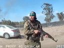 Video grab of an armed Hamas terrorist walks around the Supernova music festival, near Kibbutz Reim in southern Israel, Oct. 7, 2023.