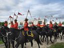 Members of the RCMP Musical Ride ride past fans as they prepare to perform at the Sunset Ceremony in Ottawa on June 30, 2024. PHOTO BY CHRISTOPHER NARDI/NATIONAL POST