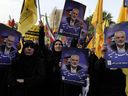 Iranian protesters attend a demonstration to condemn the killing of Hamas leader Ismail Haniyeh. (AP Photo/Vahid Salemi)