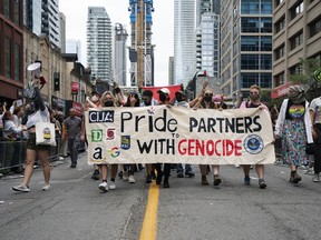 Pro Palestinian protesters disrupt the Toronto Pride Parade, on Sunday, June 30, 2024.