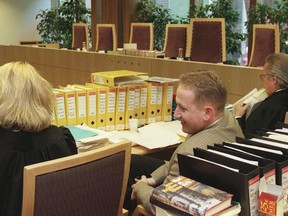 FILE - Pål Enger, center, sits in court during his appeal case, in the Borgarting Court of Appeal in Oslo, Monday, April 7, 1997. Enger, a talented Norwegian soccer player turned gentleman art thief who pulled off the sensational 1994 heist of Edvard Munch's famed "The Scream" painting at the National Gallery in Oslo and later exhibited his abstract paintings in a gallery, is dead at 57. Press officer Tina Wulf at Vålerenga Fotball, an acclaimed Oslo soccer club, told the Associated Press on Tuesday, July 2, 2024, that Enger died Saturday evening.