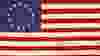 Betsy Ross American Revolution flag with thirteen stars.