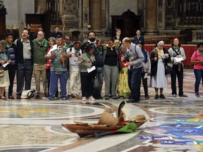 FILE - A Amazonian indigenous statue of a pregnant woman is seen as participants in the Amazon synod, attend the opening prayer in St. Peter's Basilica at the Vatican, Monday, Oct. 7, 2019. Vandals have beheaded a sculpture featuring the Virgin Mary giving birth to Jesus that had been exhibited in the cathedral in the Austrian city of Linz and drawn criticism from some traditionalist Catholics who said it was blasphemous. The identity of the vandals wasn't known. But Alexander Tschugguel, an Austrian traditionalist Catholic responsible for the so-called "Pachamama" act of vandalism during the Vatican's 2019 Amazon synod, said in a social media post Tuesday July 2, 2024 that he had been contacted by those responsible. Tschugguel became a hero to traditionalists in 2019, when he snuck into a Vatican-area church, stole Amazonian indigenous statues of pregnant women, and threw them into the Tiber River in a videotaped act that was quickly shared online.