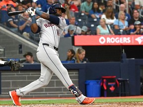 Houston Astros' Yordan Alvarez (44) hits a solo home run against the Toronto Blue Jays during sixth inning MLB baseball action in Toronto on Wednesday, July 3, 2024.