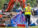 Workers dismantle the anti-Israel encampment at McGill University in Montreal on July 10.