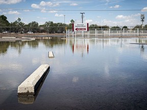 A pool of water lingers after a late-night flash flood near the Pueblo Indian Cultural Center, Sunday, June 30, 2024, in Albuquerque, New Mexico.