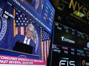 FILE - A news conference with Federal Reserve Chair Jerome Powell appears on a monitor on the floor at the New York Stock Exchange in New York, May 1, 2024. The Federal Reserve delivers the minutes from its most recent interest rate policy meeting on Wednesday, July 3, 2024.
