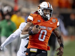FILE - Oklahoma State running back Ollie Gordon II (0) runs for a touchdown during the second half of an NCAA college football game against Cincinnati Saturday, Oct. 28, 2023, in Stillwater, Okla. Gordon was arrested Sunday, June 30, 2024, morning under suspicion of driving under the influence.