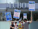 LCBO employees picket in front of a closed LCBO store in downtown Ottawa on Friday, July 5, 2024.