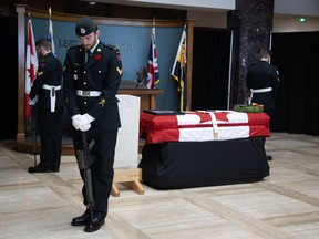 Members of the Royal Newfoundland Regiment stand guard over the remains of an Unknown Newfoundland soldier as he lies in state at the Confederation Building in St. John's on Friday, June 28, 2024.