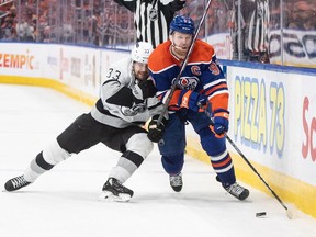 Los Angeles Kings' Viktor Arvidsson (33) and Edmonton Oilers' Connor McDavid (97) battle for the puck during NHL playoff action in Edmonton on Wednesday April 24, 2024.The Oilers have signed forward Arvidsson to a two-year, US$4-million contract and also extended Connor Brown's contract one year.