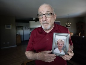 Jean-Luc Duval holds a picture of his late wife, Monique, in his home Friday, June 14, 2024, in Repentigny, Que. .THE CANADIAN PRESS/Ryan Remiorz