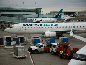 WestJet planes at Toronto Pearson International Airport in Toronto, Ontario, Canada, on Saturday, Dec. 9, 2023.