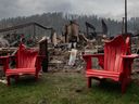 Melted chairs are shown outside of the burned Maligne Lodge after wildfires encroached into Jasper, Alta., on Friday, July 26, 2024.
