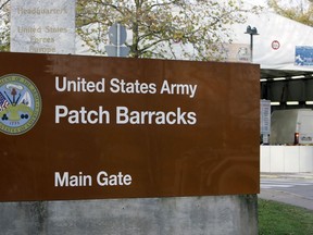 FILE - The main entrance for the U.S. Army Patch Barracks in Stuttgart, Germany, Nov. 28, 2006, where the headquarters of the U.S. European Command (EUCOM) is located. The U.S, military has raised the security protection measures it is taking at its bases throughout Europe, asking service members to be more vigilant and keep a lower profile due to a combination of threats it's seeing across the region.