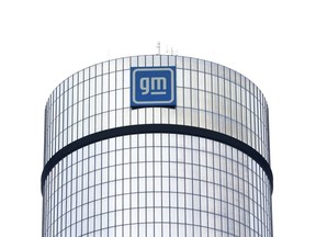 FILE - A General Motors logo is seen on a building, April 24, 2024, in Detroit. GM will pay nearly $146 million in penalties to the federal government because 5.9 million of its older vehicles don't comply with emissions and fuel economy standards.