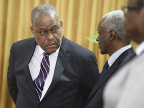 FILE - Haitian Prime Minister Garry Conille, left, speaks to Transitional Council President Edgard Leblanc Fils, during Conille's swearing-in ceremony in Port-au-Prince, Haiti, June 3, 2024. U.S. officials asked Conille on July 2, 2024, to prioritize the establishment of an electoral council as the country strives to rebuild its government.