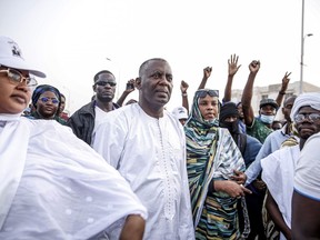 Presidential candidate Biram Ould Dah Ould Abeid, center, takes part in a rally among his supporters, ahead of the presidential election end of the month, in Nouakchott, Mauritania, Monday, June 24, 2024.