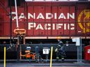 A CP Rail employee walks past locomotives in the Alyth yards in Calgary, Sept. 2021.
Gavin Young/Postmedia