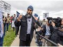 NDP leader Jagmeet Singh speaks to striking CN Rail employees, members of the Teamsters union, on their picket line in the Lachine borough of Montreal Thursday August 22, 2024.