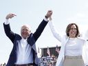 U.S. Vice President and 2024 Democratic presidential candidate Kamala Harris and her running mate Minnesota Governor Tim Walz greet supporters as they arrive to a campaign rally in Eau Claire, Wisconsin, August 7, 2024.