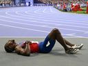 Noah Lyles reacts after competing in the men's 200m final of the athletics event at the Paris 2024 Olympic Games. After the race, Lyles admitted he had COVID.