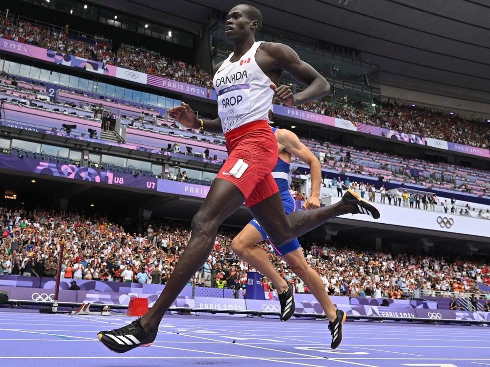 NextImg:Marco Arop claims silver in 800m: Canadian misses Olympic gold by one hundredth of a second