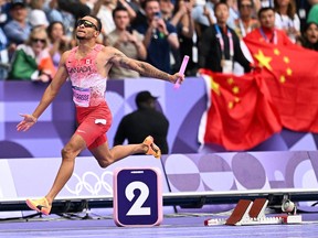 Canada's Andre De Grasse celebrates after winning the men's 4x100m relay final.