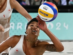Canada's Brandie Wilkerson reaches for the ball in the women's gold medal beach volleyball match against Brazil during the Paris 2024 Olympic Games.