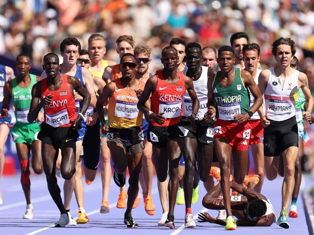 NextImg:Carnage in the 5,000m: Moh Ahmed out of Olympic final after brutal fall in first heat