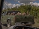A Ukrainian military vehicle drives from the direction of the border with Russia carrying blindfolded men in Russian military uniforms, in the Sumy region, on August 13, 2024. (Photo by ROMAN PILIPEY/AFP via Getty Images)