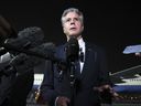 U.S. Secretary of State Antony Blinken speaks to reporters on the tarmac in Doha on August 20, 2024.