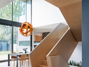 By removing the inside back half of the centre “block,” the architect created drama in the form of a double-height atrium.