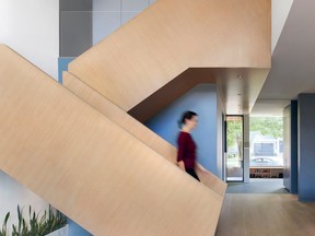 Angling the grain of the oak cladding on the staircase adds visual movement.