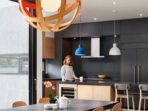 By opening the living areas of the main floor to each other and defining their boundaries only loosely, the architect lets each room borrow from the others, creating the feeling of more space.