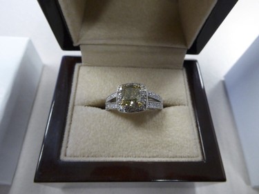 A ring with a coloured diamond