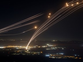 Lights from rocket light up the sky over Israel.
