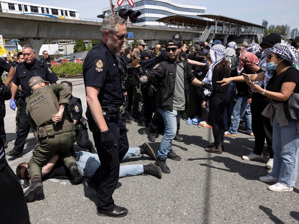 NextImg:Thirteen anti-Israel protesters charged for blocking railway in Vancouver: police