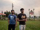 Maharshi Patel, 22, right, and his brother Om Patel, 21, on the front lawn of their fully booked family run motel in Hinton, Alta., on Thursday, August 15, 2024.