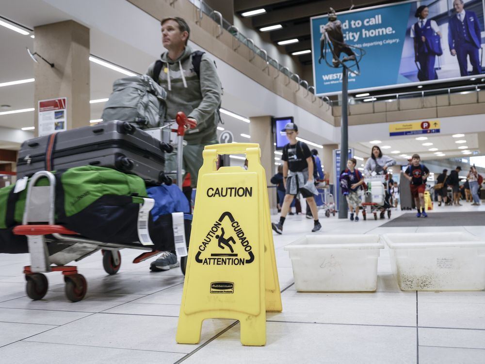 NextImg:Traveller witnesses pouring water, falling ceiling tiles at Calgary airport